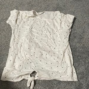 Black poke-a-dots on a white shirt